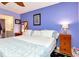 Cozy bedroom with blue walls, ceiling fan, and decorative touches creating a serene space at 11201 122Nd Ave # 167, Largo, FL 33778