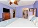 Bedroom with a chest of drawers, TV, and doorway to bathroom and closet at 11201 122Nd Ave # 167, Largo, FL 33778