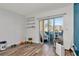 Bonus room featuring sliding glass doors and wood-look flooring at 11201 122Nd Ave # 167, Largo, FL 33778