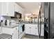 Clean white kitchen features granite countertops, stainless steel appliances, and lots of light at 11201 122Nd Ave # 167, Largo, FL 33778