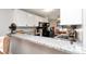 Kitchen features a granite countertop, sleek appliances, and an open layout for easy entertaining at 11201 122Nd Ave # 167, Largo, FL 33778
