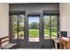 Enclosed lanai with glass doors offering a view of the well-maintained backyard at 11201 122Nd Ave # 167, Largo, FL 33778