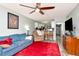 Bright living room with breakfast bar and comfortable seating, seamlessly flowing into the kitchen at 11201 122Nd Ave # 167, Largo, FL 33778