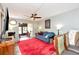 Comfortable living room with fan, area rug, and ample seating, perfect for relaxation at 11201 122Nd Ave # 167, Largo, FL 33778