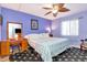 Charming bedroom featuring a ceiling fan, carpet and ample natural light at 11201 122Nd Ave # 167, Largo, FL 33778