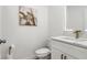 Stylish half-bath with modern vanity, decorative mirror, and contemporary fixtures at 11508 Sage Canyon Dr, Riverview, FL 33578