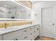 Stylish bathroom boasts double sinks and modern gold fixtures at 11508 Sage Canyon Dr, Riverview, FL 33578