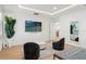 Bright bedroom features a modern design, large TV, decorative ceiling, stylish seating and wooden floor at 11508 Sage Canyon Dr, Riverview, FL 33578
