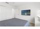 Cozy bedroom with ensuite and a large television at 11508 Sage Canyon Dr, Riverview, FL 33578