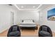 Bright bedroom features a modern design, decorative ceiling, stylish seating and wooden floor at 11508 Sage Canyon Dr, Riverview, FL 33578