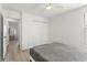 A bedroom with wood-look floors, a closet, and natural light from the window at 11508 Sage Canyon Dr, Riverview, FL 33578