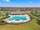 Aerial view of a large community pool with ample seating and covered area at 11508 Sage Canyon Dr, Riverview, FL 33578