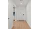 Bright entryway with light wood floors and a white front door, creating a welcoming first impression at 11508 Sage Canyon Dr, Riverview, FL 33578