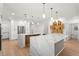 Expansive kitchen featuring double islands, stainless steel appliances, ample cabinet space, and modern fixtures at 11508 Sage Canyon Dr, Riverview, FL 33578