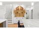 Bright kitchen featuring modern white cabinetry, marble counters, and a decorative arch display at 11508 Sage Canyon Dr, Riverview, FL 33578