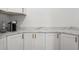 Bright kitchen featuring white cabinets, modern countertops, and a coffee bar area perfect for morning routines at 11508 Sage Canyon Dr, Riverview, FL 33578