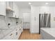 Well-designed kitchen with white cabinetry, modern appliances, and sleek countertops for a clean and stylish look at 11508 Sage Canyon Dr, Riverview, FL 33578