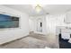 A bright living room with open space, modern lighting, and wood-look flooring throughout at 11508 Sage Canyon Dr, Riverview, FL 33578