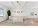 Bright living room with neutral-toned sectional sofa, light hardwood floors, and minimalist decor at 11508 Sage Canyon Dr, Riverview, FL 33578