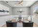 Stylish home office featuring gray walls, modern lighting, sleek desk, and a window view of the outdoors at 11508 Sage Canyon Dr, Riverview, FL 33578