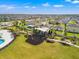 A community playground with swings and covered seating areas are set amongst the lush green space at 11508 Sage Canyon Dr, Riverview, FL 33578