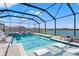 Relaxing screened-in pool features a spa and lounge chairs at 11508 Sage Canyon Dr, Riverview, FL 33578