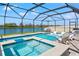 Gorgeous screened-in pool and hot tub area overlooks a tranquil lake at 11508 Sage Canyon Dr, Riverview, FL 33578