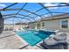 A stunning screened-in pool with spa and lake view offers the ultimate relaxation and entertainment space at 11508 Sage Canyon Dr, Riverview, FL 33578