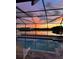 Backyard pool with a beautiful sunset view reflecting over the lake at 11508 Sage Canyon Dr, Riverview, FL 33578