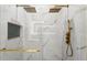 Close up of a modern glass shower with double rain shower heads and marble tile at 11508 Sage Canyon Dr, Riverview, FL 33578