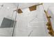 Close up of a modern glass shower with double rain shower heads and marble tile at 11508 Sage Canyon Dr, Riverview, FL 33578