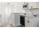Home wet bar with marble backsplash, stainless steel wine chiller, and modern lighting at 11508 Sage Canyon Dr, Riverview, FL 33578