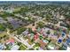 Aerial view of the neighborhood highlighting the home's location with nearby homes and businesses at 11746 93Rd Ave, Seminole, FL 33772