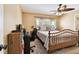 Cozy bedroom featuring neutral colors, a ceiling fan, and lots of natural light at 11746 93Rd Ave, Seminole, FL 33772