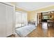 Versatile bonus room with sliding glass doors and wood flooring at 11746 93Rd Ave, Seminole, FL 33772