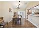 Bright dining room features wood floors and a charming chandelier at 11746 93Rd Ave, Seminole, FL 33772