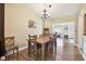 Bright dining room features wood floors and a charming chandelier at 11746 93Rd Ave, Seminole, FL 33772