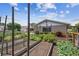 Backyard garden with raised beds, a chicken coop, and the home's exterior at 11746 93Rd Ave, Seminole, FL 33772