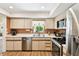 Bright kitchen featuring stainless steel appliances and a window above the sink at 11746 93Rd Ave, Seminole, FL 33772