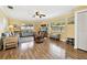 Bright and airy living room featuring wood floors and comfortable furnishings at 11746 93Rd Ave, Seminole, FL 33772