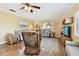 Inviting living room featuring wood floors, comfortable seating, and natural light at 11746 93Rd Ave, Seminole, FL 33772