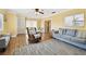 Cozy living room with neutral colored walls and a gray sofa at 11746 93Rd Ave, Seminole, FL 33772