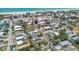 An aerial view of a neighborhood near the beach, showcasing beautiful homes and proximity to the ocean at 123 14Th Ave, Indian Rocks Beach, FL 33785