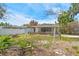 This cozy home features a private, grassy backyard, partially fenced for outdoor enjoyment at 123 14Th Ave, Indian Rocks Beach, FL 33785