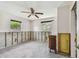 Bedroom with natural light, ceiling fan, and accessible doorway; ready for remodel at 123 14Th Ave, Indian Rocks Beach, FL 33785