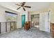 Bedroom with windows, closet, ceiling fan, and doorway leading to the interior at 123 14Th Ave, Indian Rocks Beach, FL 33785