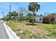 The home's curb appeal is enhanced by its lush green lawn and convenient street access at 123 14Th Ave, Indian Rocks Beach, FL 33785