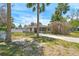 Charming single-story home featuring a sunny front yard, tall palm trees and cozy exterior at 123 14Th Ave, Indian Rocks Beach, FL 33785