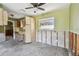 Awaiting renovation, this kitchen has an open layout, classic cabinetry, and natural light at 123 14Th Ave, Indian Rocks Beach, FL 33785