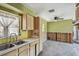 Bright kitchen features a double sink, wooden cabinets, and an open layout for customization at 123 14Th Ave, Indian Rocks Beach, FL 33785